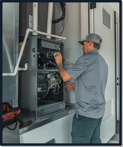 Action Mechanical Tech working on furnace